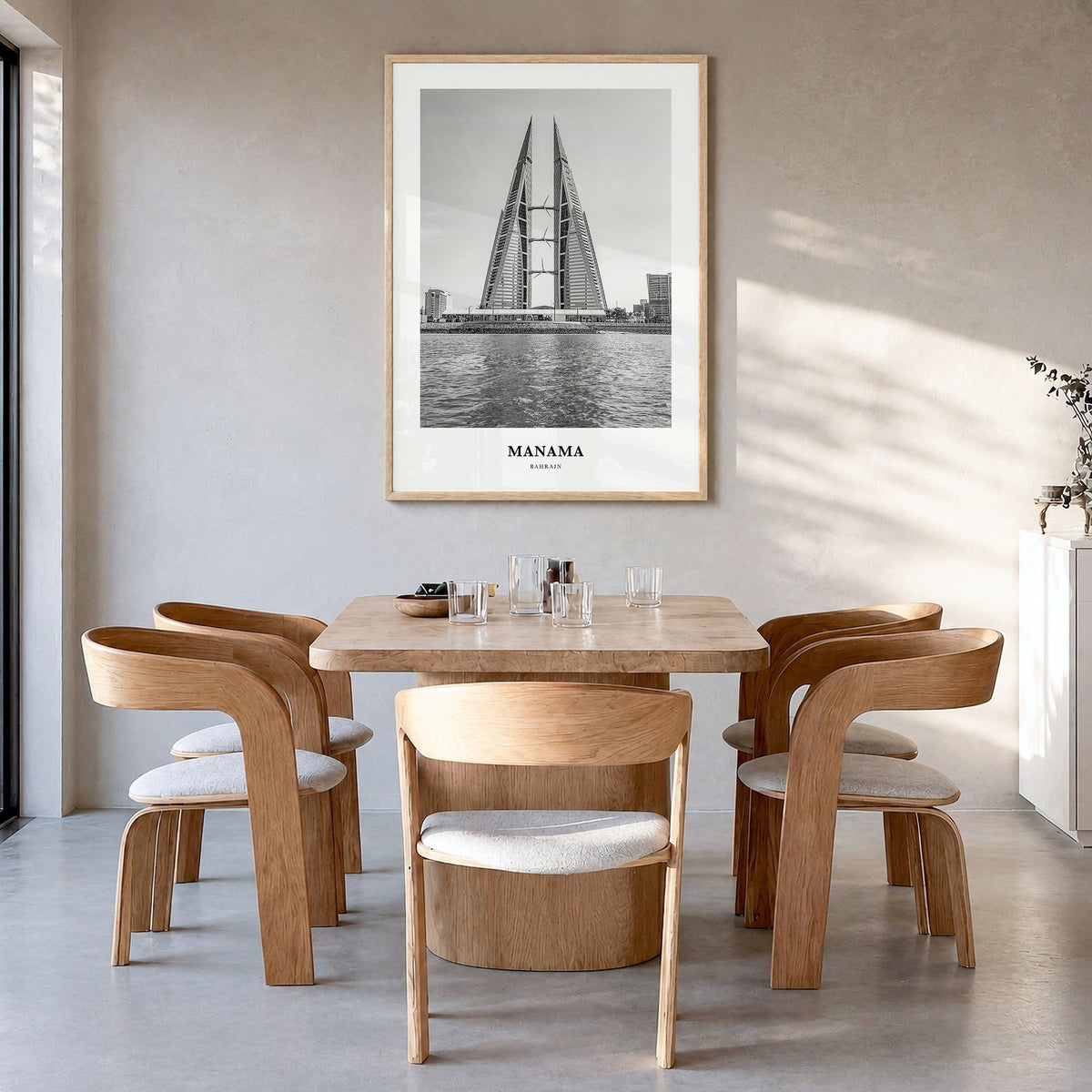 Manama Classic Poster in a natural wood frame, hanging in a dining room