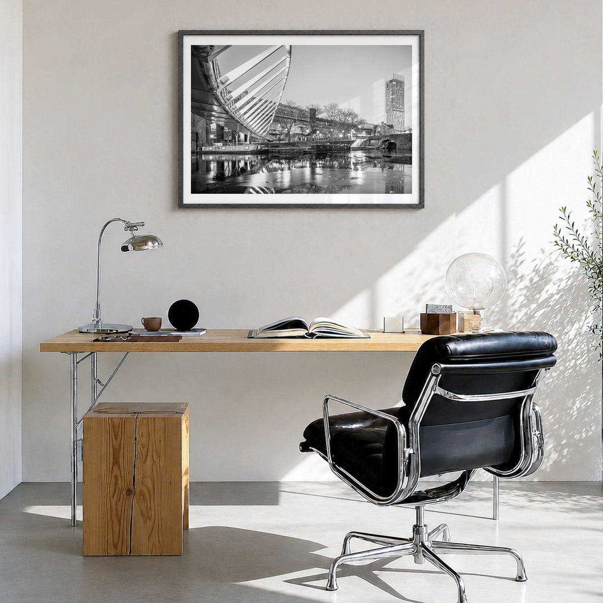Manchester, England Photo Poster in a black wood frame, hanging in a bright home office, white border