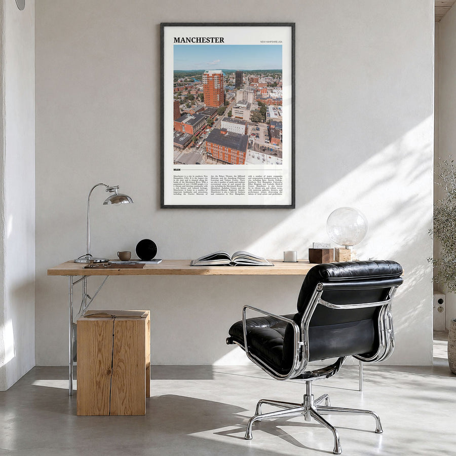Manchester, New Hampshire Travel Poster in a black wood frame, hanging in a bright home office