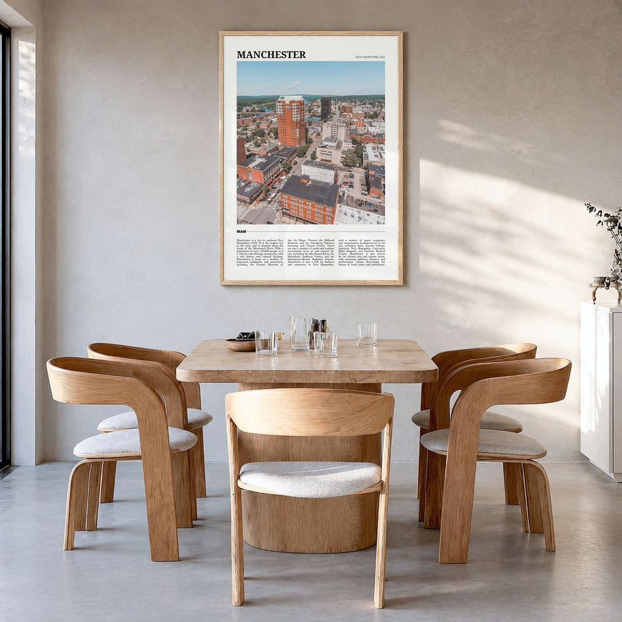 Manchester, New Hampshire Travel Poster in a natural wood frame, hanging in a dining room