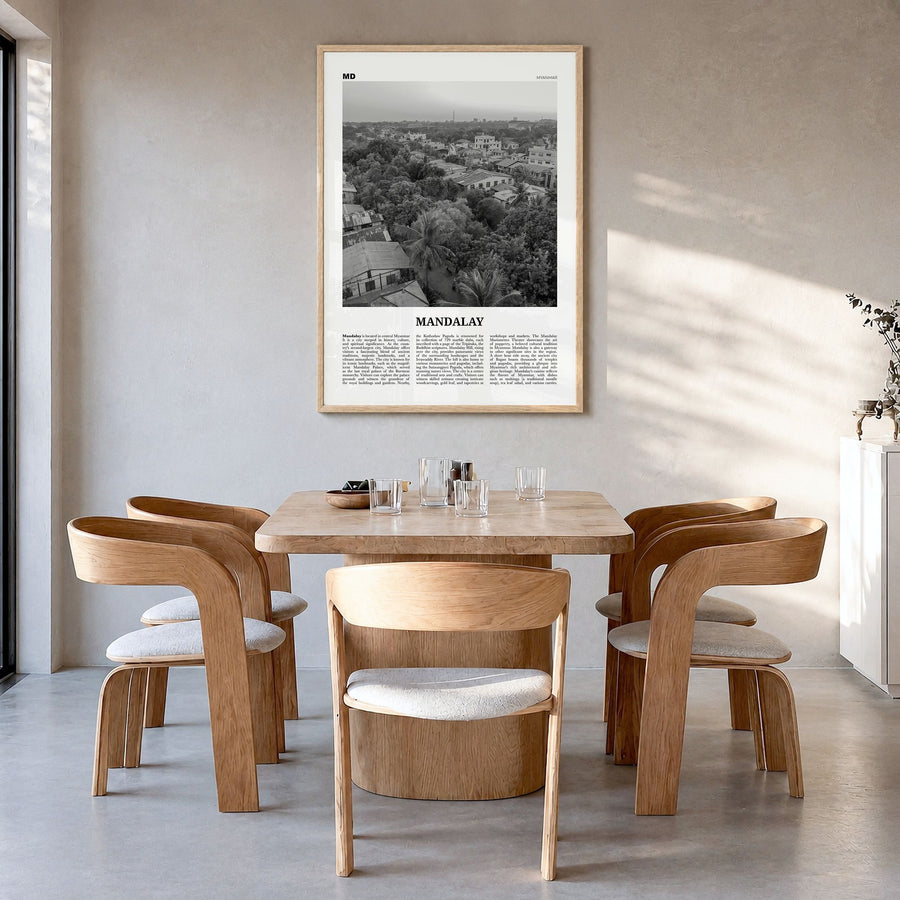 Mandalay Newspaper Poster in a natural wood frame, hanging in a dining room