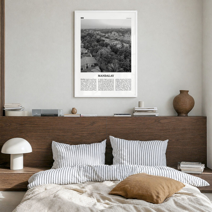 Mandalay Newspaper Poster in a white wood frame, hanging in a bedroom