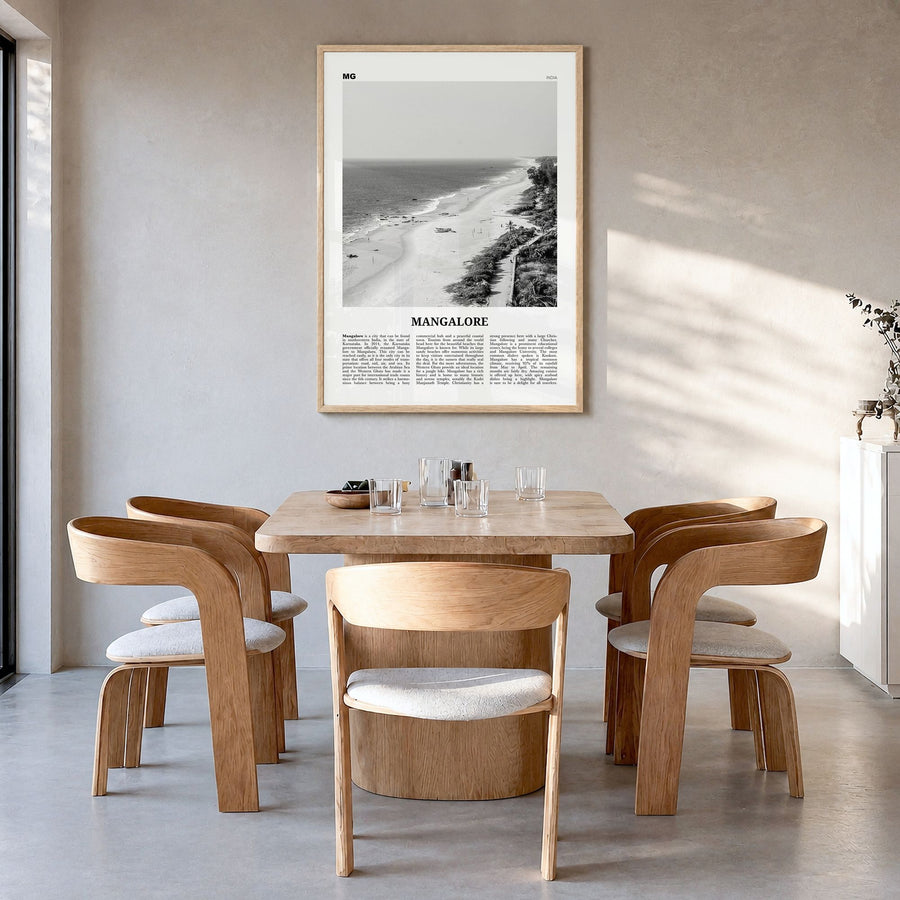 Mangalore Newspaper Poster in a natural wood frame, hanging in a dining room