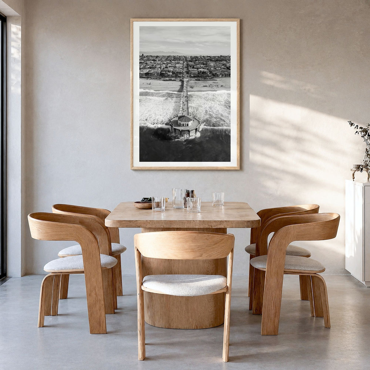 Manhattan Beach Photo No 1 Poster in a natural wood frame, hanging in a dining room, white border