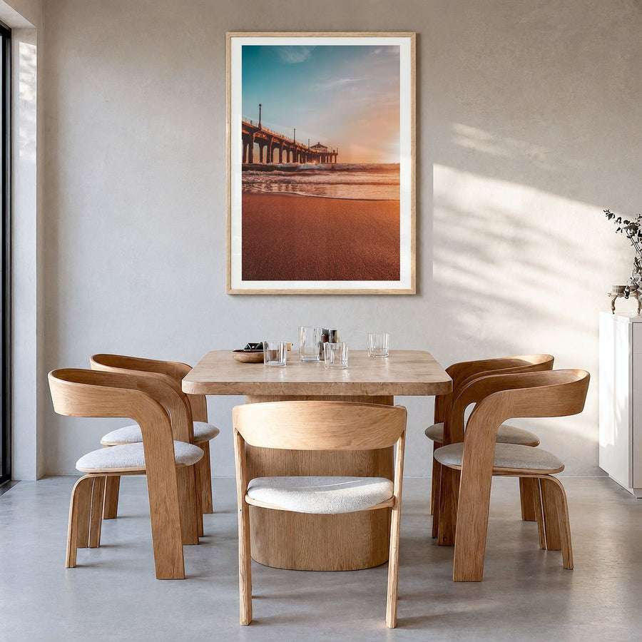 Manhattan Beach Photo No 2 Poster in a natural wood frame, hanging in a dining room, white border