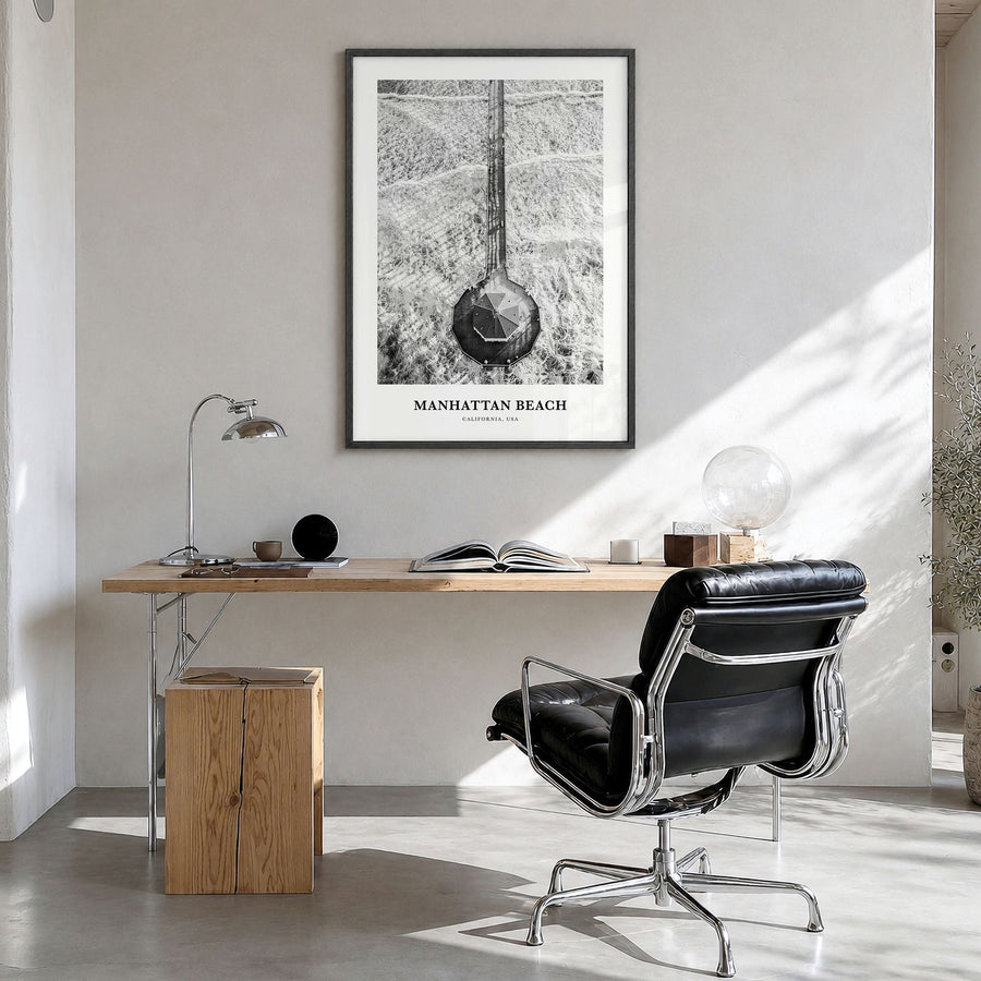 Manhattan Beach Classic Poster in a black wood frame, hanging in a bright home office