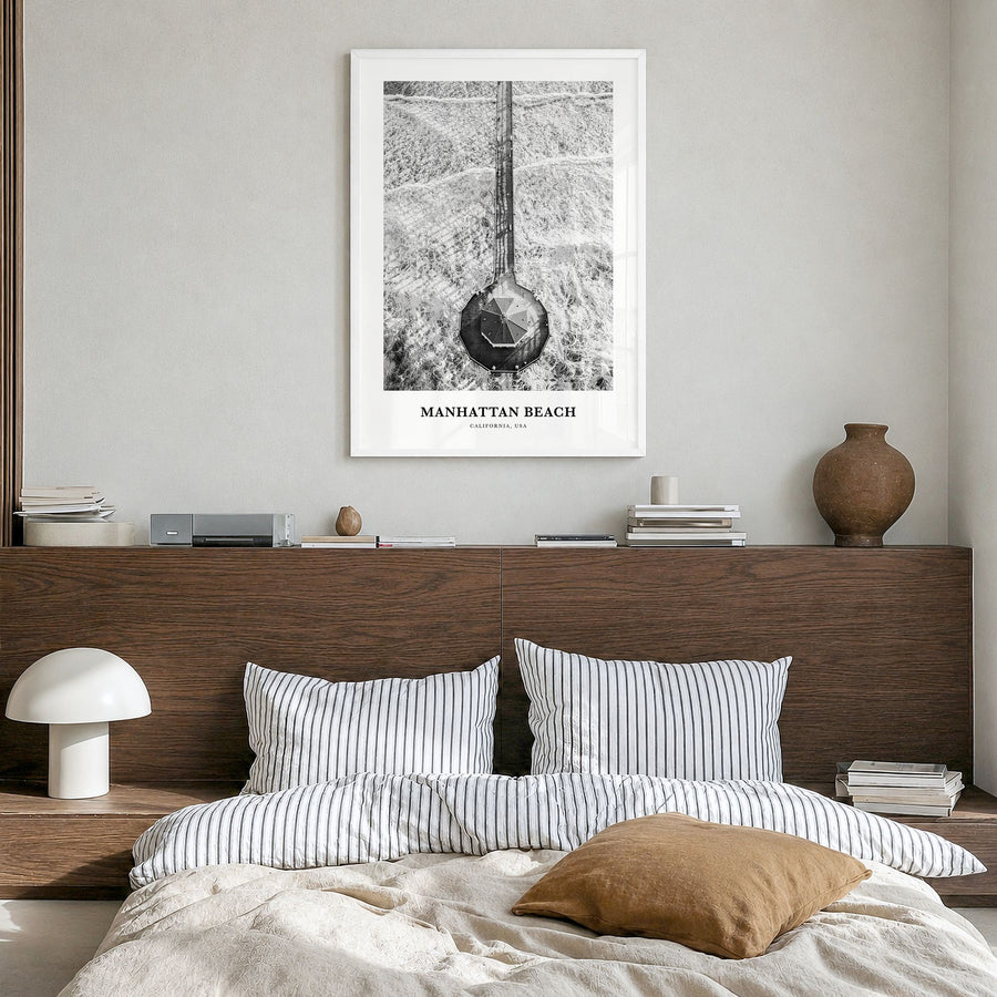 Manhattan Beach Classic Poster in a white wood frame, hanging in a bedroom