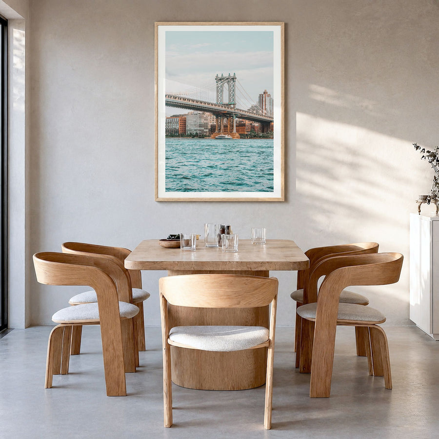 Manhattan Bridge Photo No 2 Poster in a natural wood frame, hanging in a dining room, white border
