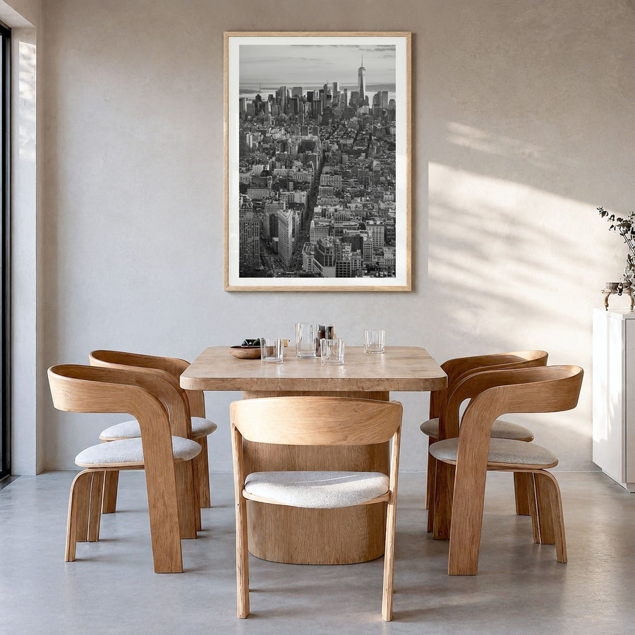 Manhattan Photo No 1 Poster in a natural wood frame, hanging in a dining room, white border