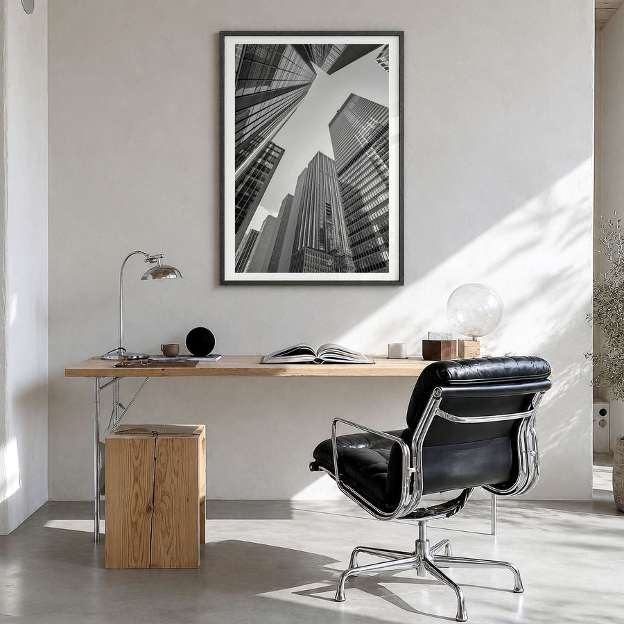 Manhattan Photo No 3 Poster in a black wood frame, hanging in a bright home office, white border