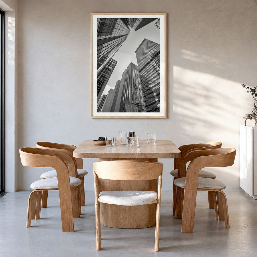 Manhattan Photo No 3 Poster in a natural wood frame, hanging in a dining room, white border
