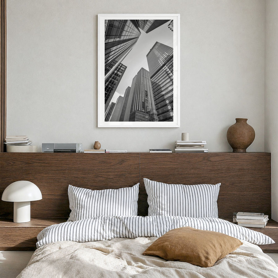 Manhattan Photo No 3 Poster in a white wood frame, hanging in a bedroom, white border