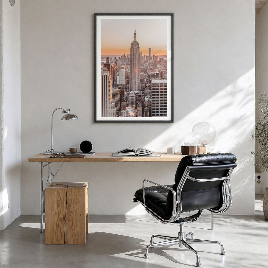 Manhattan Photo No 1 Poster in a black wood frame, hanging in a bright home office, white border