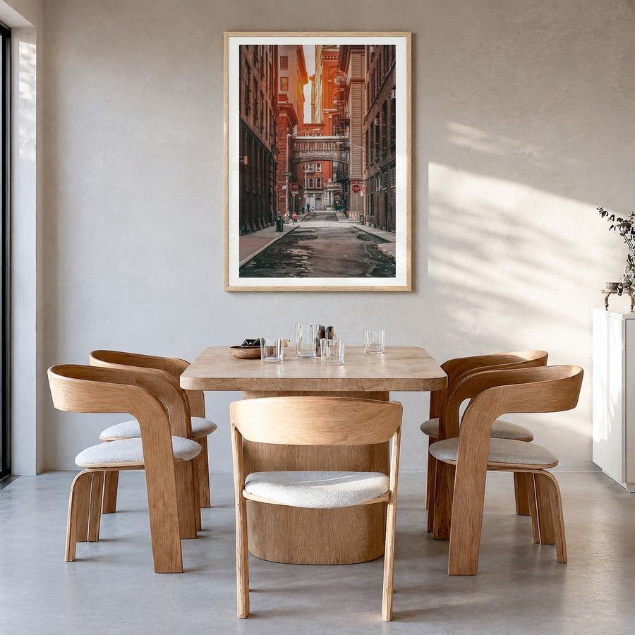 Manhattan Photo No 2 Poster in a natural wood frame, hanging in a dining room, white border
