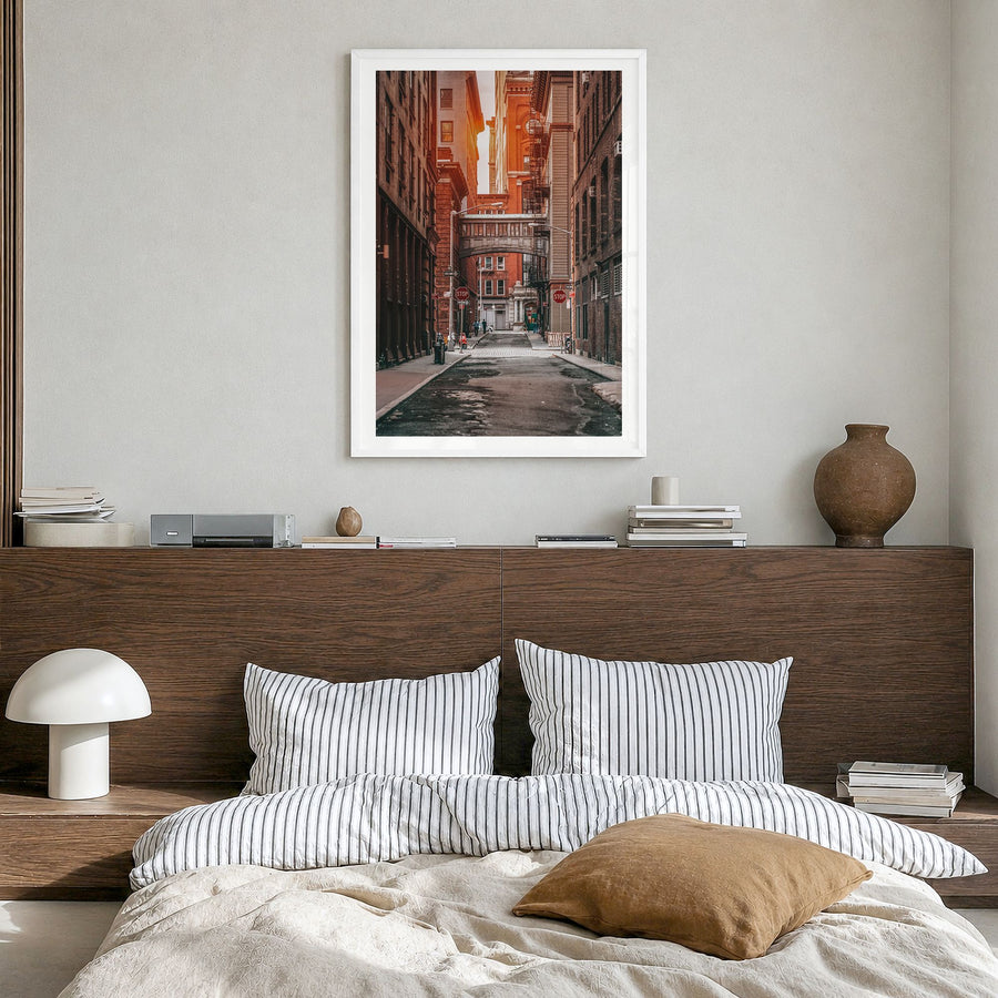 Manhattan Photo No 2 Poster in a white wood frame, hanging in a bedroom, white border