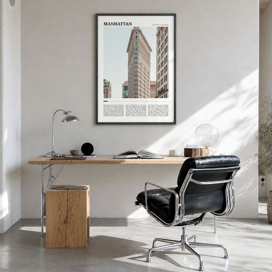 Manhattan Travel Poster in a black wood frame, hanging in a bright home office