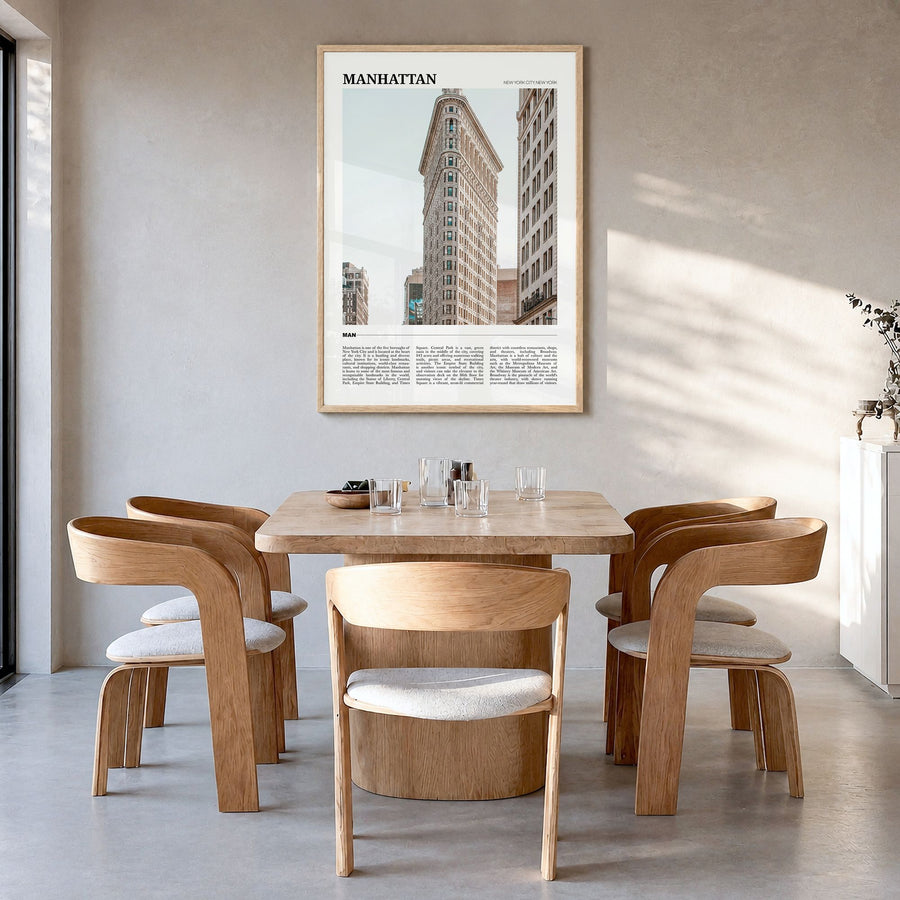 Manhattan Travel Poster in a natural wood frame, hanging in a dining room
