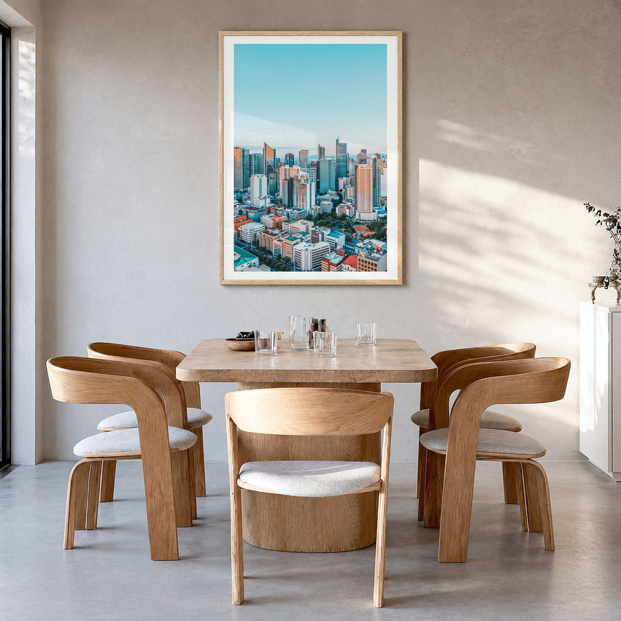 Manila Photo No 1 Poster in a natural wood frame, hanging in a dining room, white border