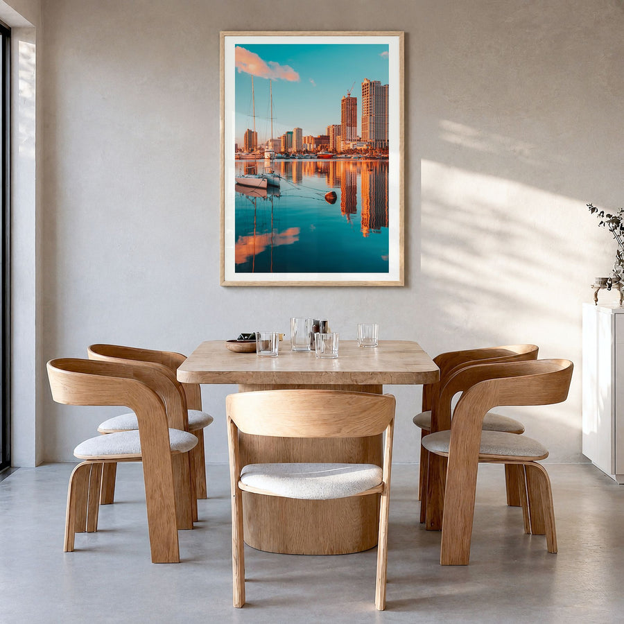Manila Photo No 2 Poster in a natural wood frame, hanging in a dining room, white border