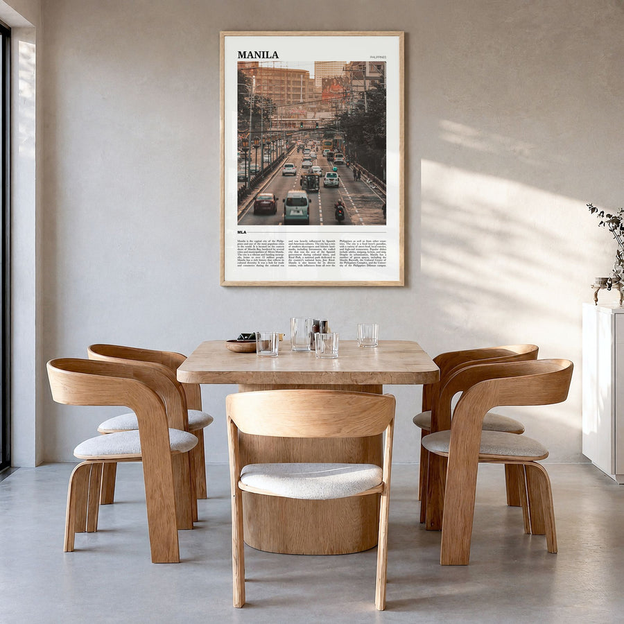 Manila Travel Poster in a natural wood frame, hanging in a dining room