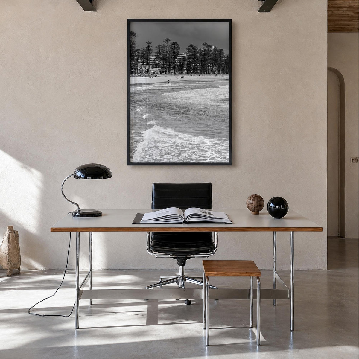 Manly Beach black & white photo poster of Sydney, New South Wales – vertical wall art in black wood frame, hanging on wall