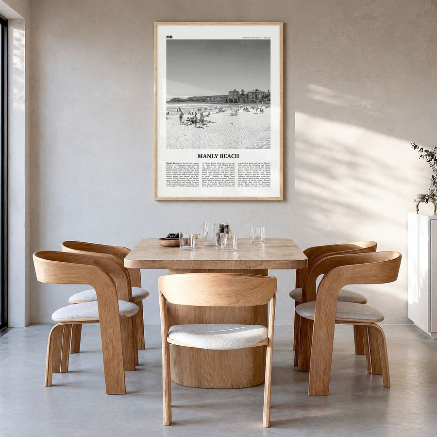 Manly Beach Newspaper Poster in a natural wood frame, hanging in a dining room