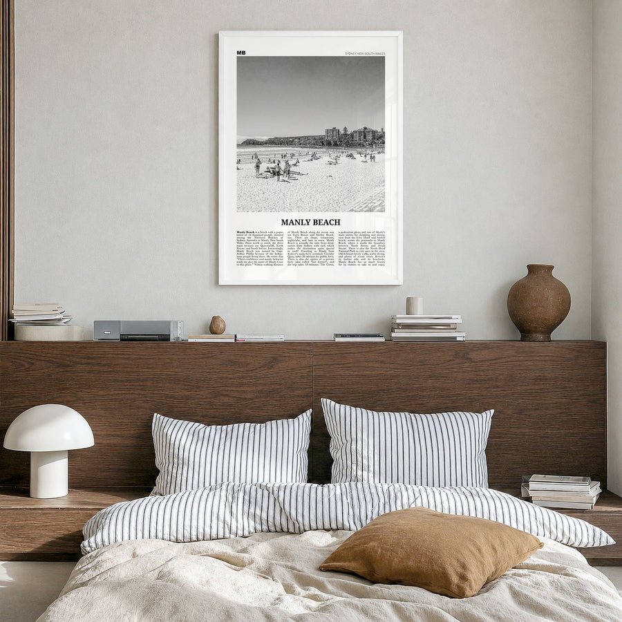 Manly Beach Newspaper Poster in a white wood frame, hanging in a bedroom