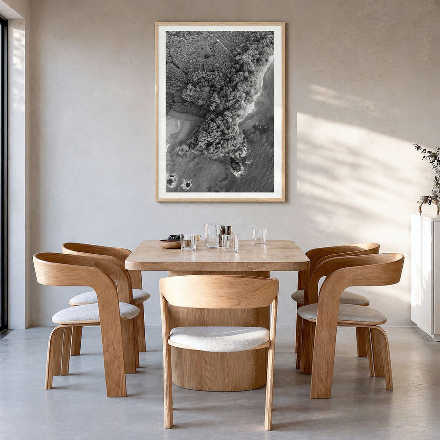 Manuel Antonio National Park Photo Poster in a natural wood frame, hanging in a dining room, white border