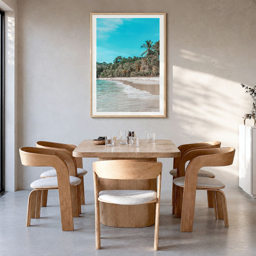 Manuel Antonio National Park Photo Poster in a natural wood frame, hanging in a dining room, white border