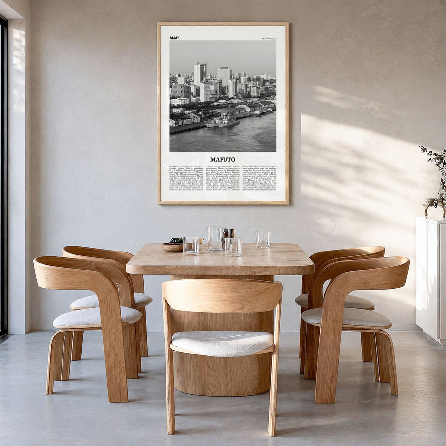 Maputo Newspaper Poster in a natural wood frame, hanging in a dining room