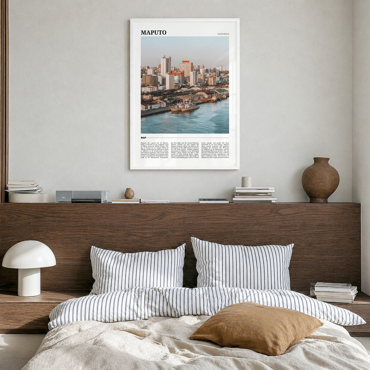 Maputo Travel Poster in a white wood frame, hanging in a bedroom