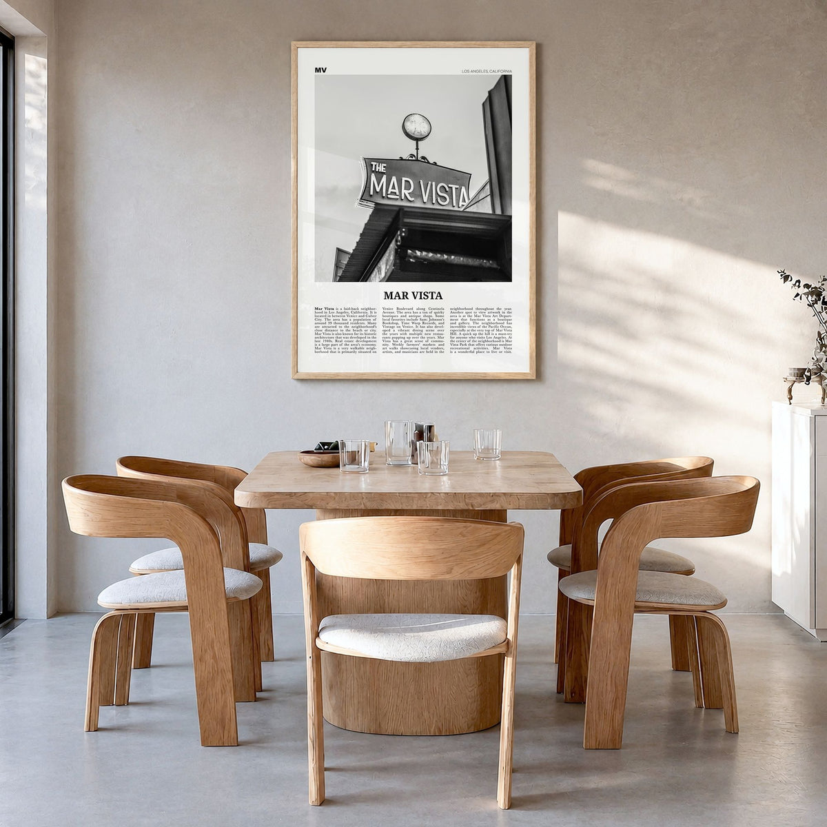 Mar Vista Newspaper Poster in a natural wood frame, hanging in a dining room