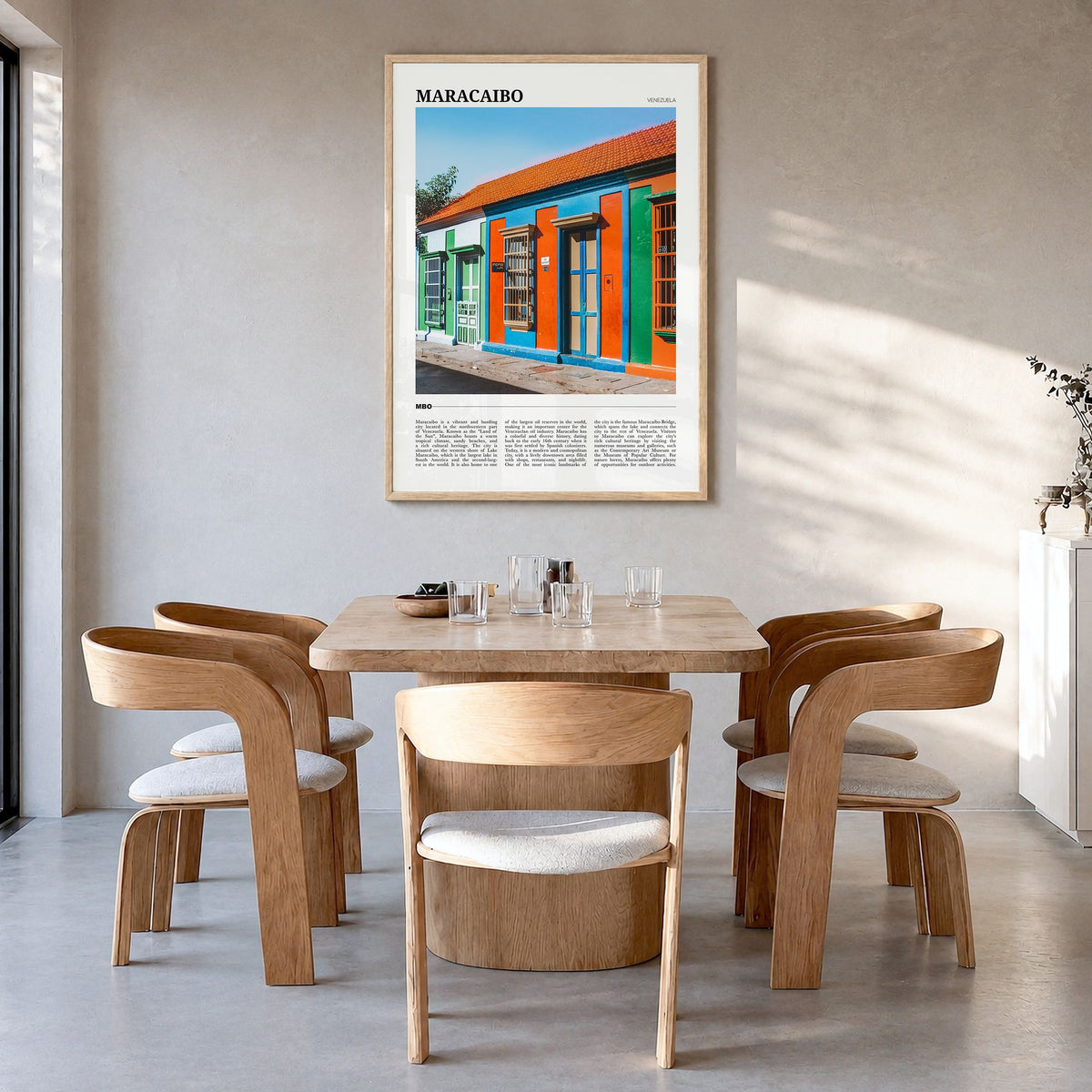 Maracaibo Travel Poster in a natural wood frame, hanging in a dining room
