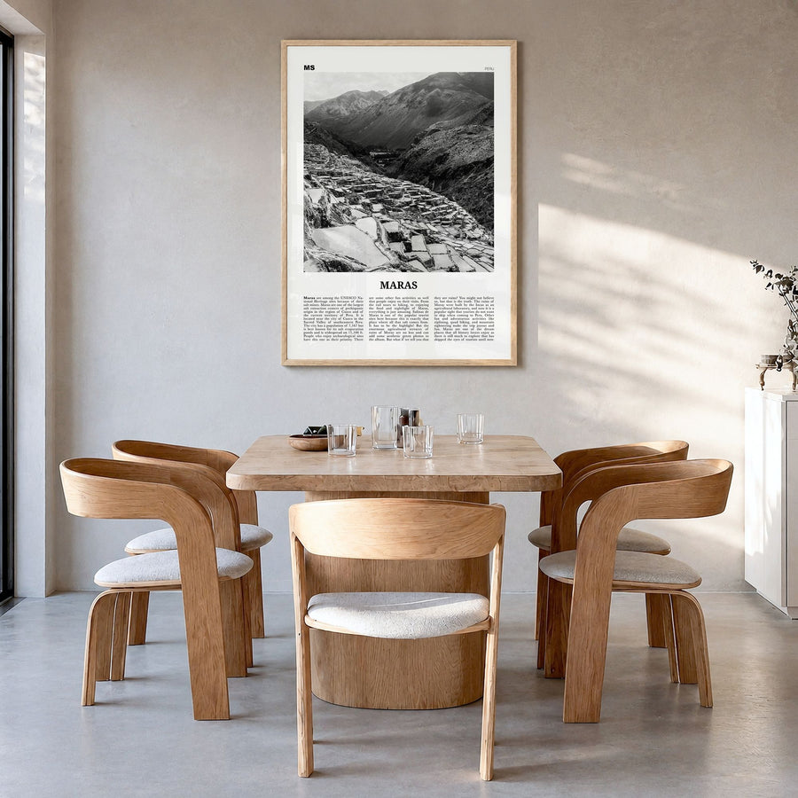 Maras Newspaper Poster in a natural wood frame, hanging in a dining room
