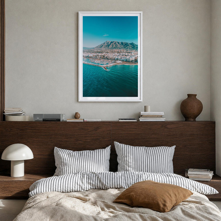 Marbella colorful photo poster of Spain – vertical wall art in white wood frame with white border, hanging on wall