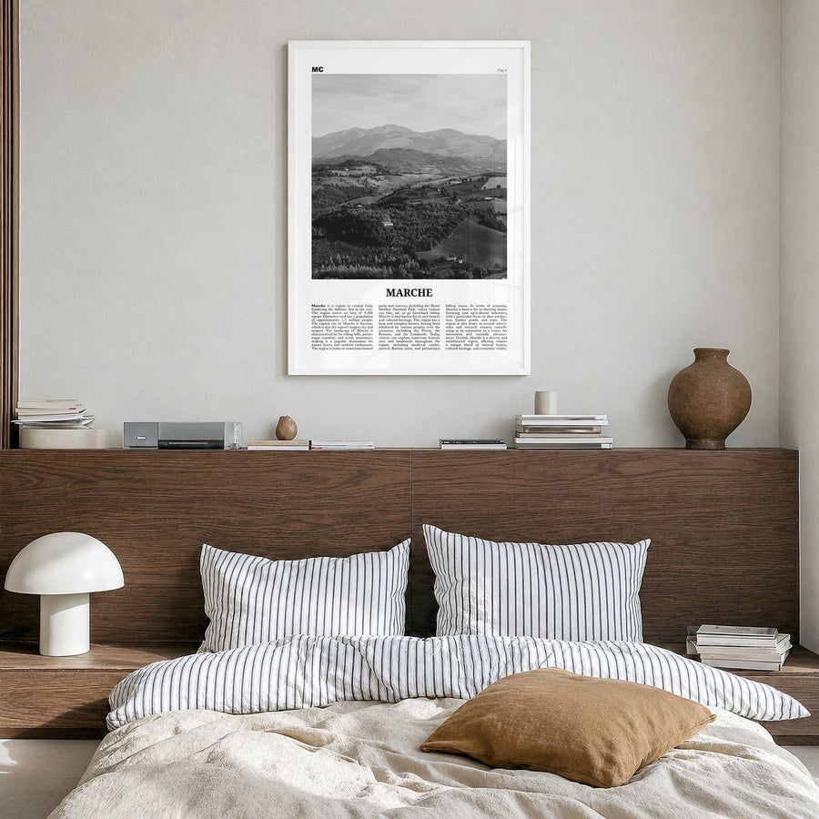 Marche Newspaper Poster in a white wood frame, hanging in a bedroom