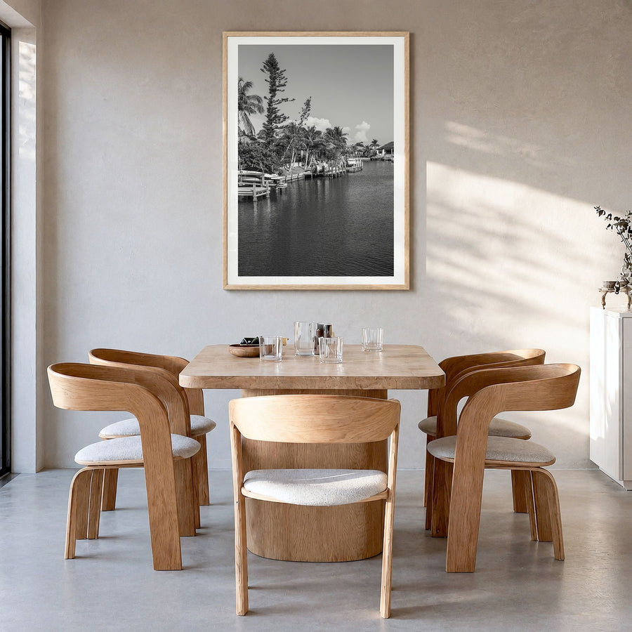 Marco Island Photo Poster in a natural wood frame, hanging in a dining room, white border
