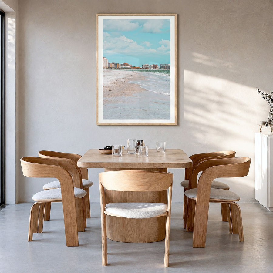 Marco Island Photo Poster in a natural wood frame, hanging in a dining room, white border