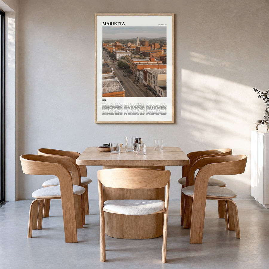 Marietta Travel Poster in a natural wood frame, hanging in a dining room