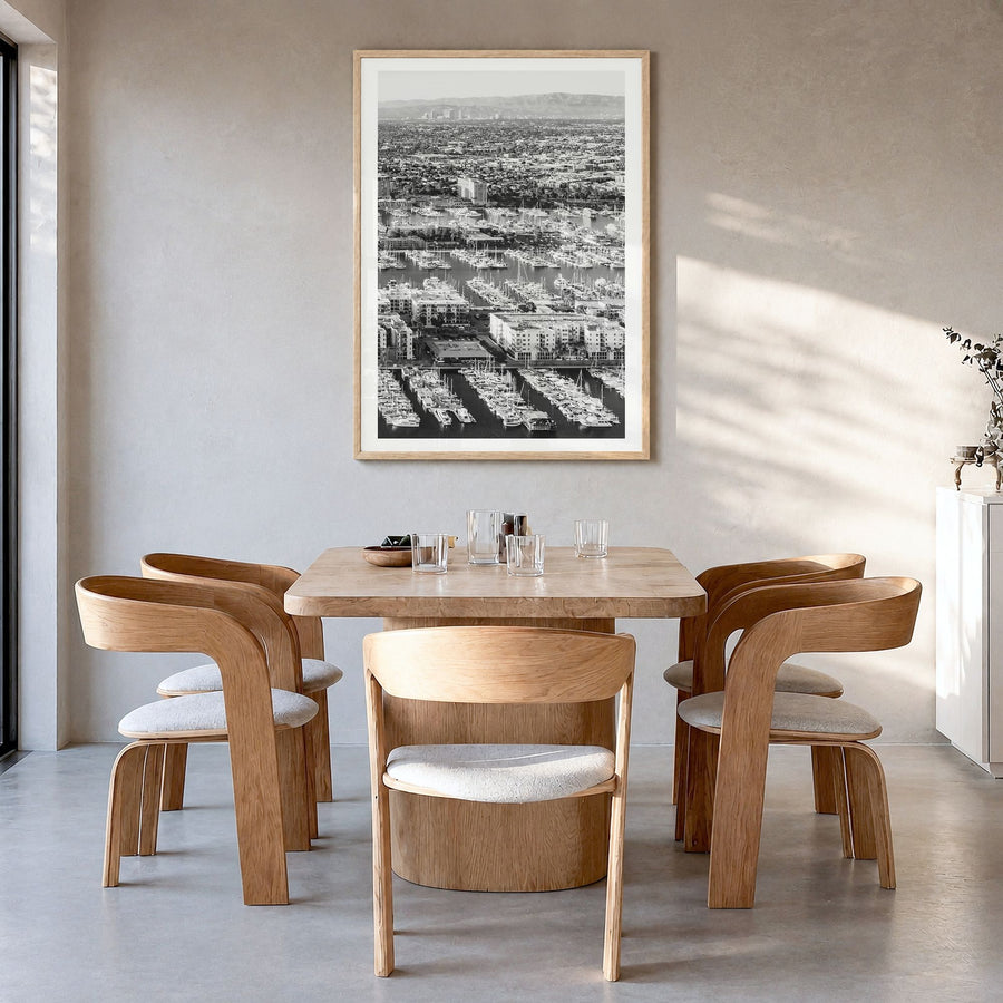 Marina del Rey Photo No 2 Poster in a natural wood frame, hanging in a dining room, white border