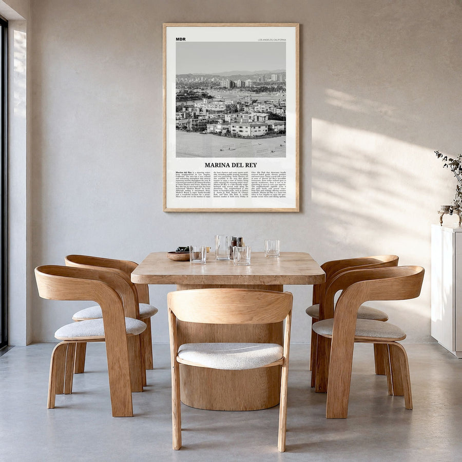 Marina del Rey Newspaper Poster in a natural wood frame, hanging in a dining room