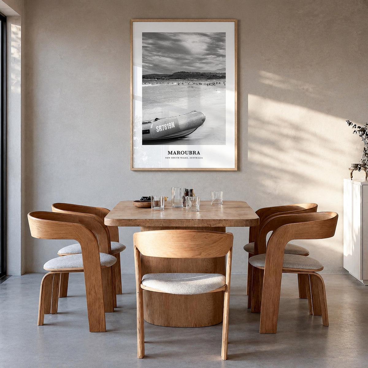 Maroubra black & white classic poster of Australia – vertical wall art in natural wood frame, hanging on wall