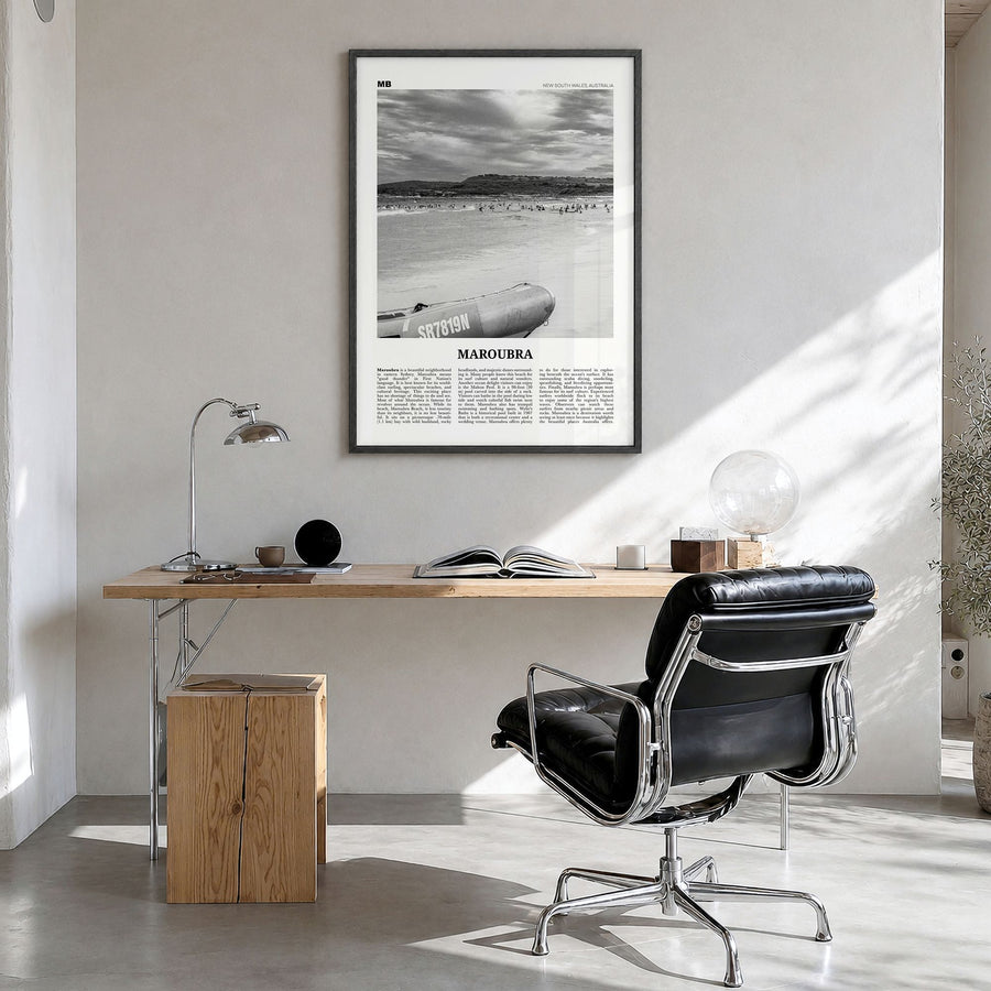 Maroubra Newspaper Poster in a black wood frame, hanging in a bright home office