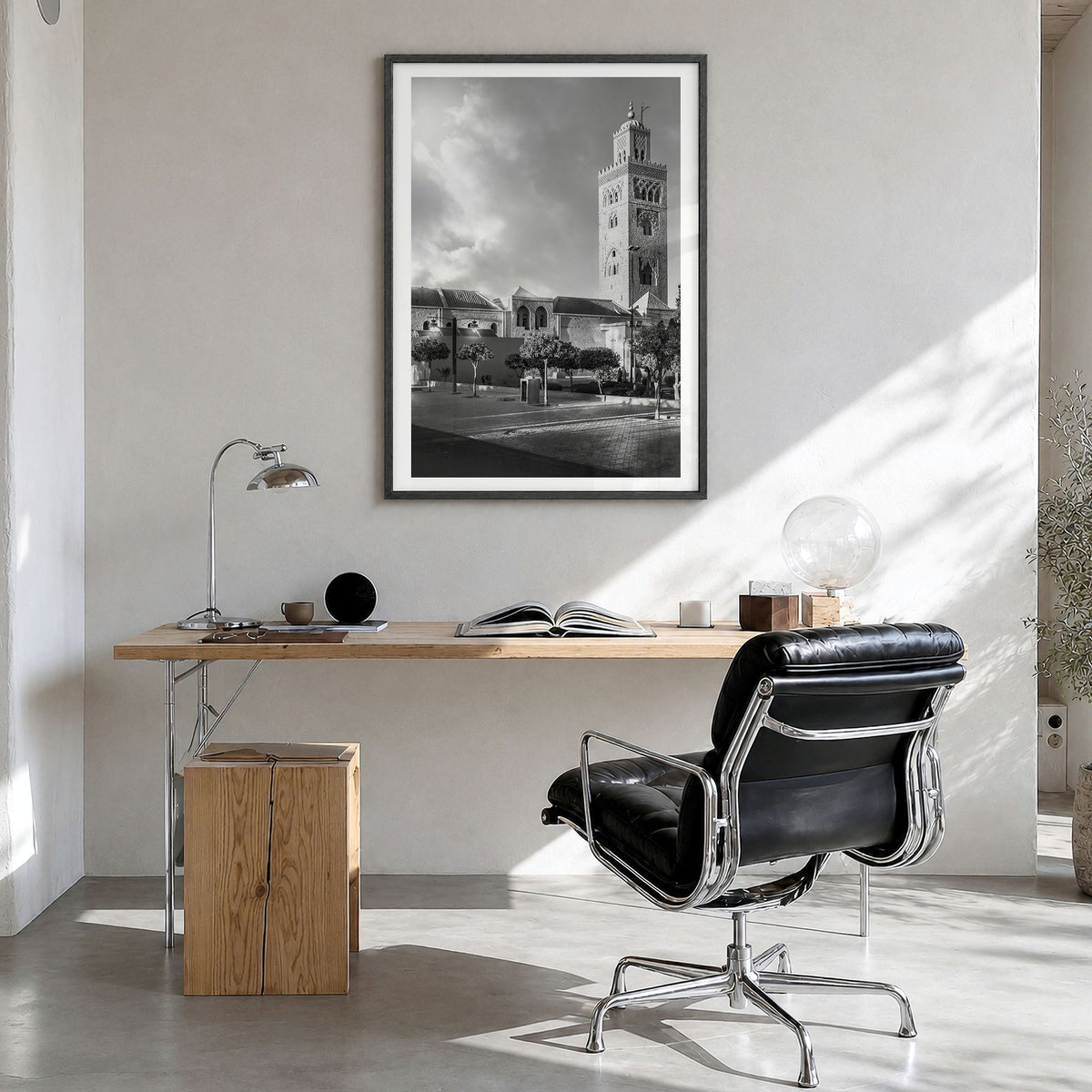 Marrakesh Photo Poster in a black wood frame, hanging in a bright home office, white border