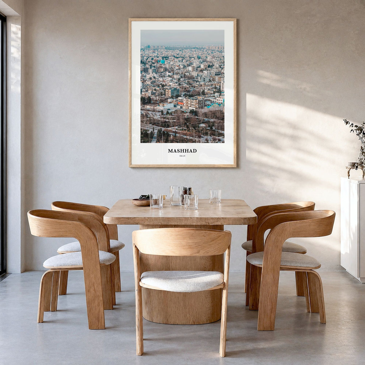 Mashhad Classic Poster in a natural wood frame, hanging in a dining room