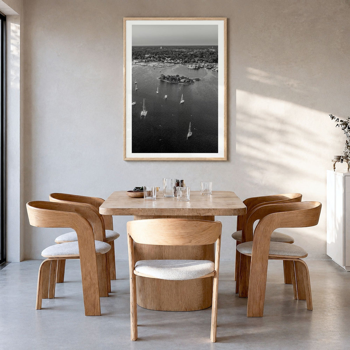 Massachusetts Photo Poster in a natural wood frame, hanging in a dining room, white border