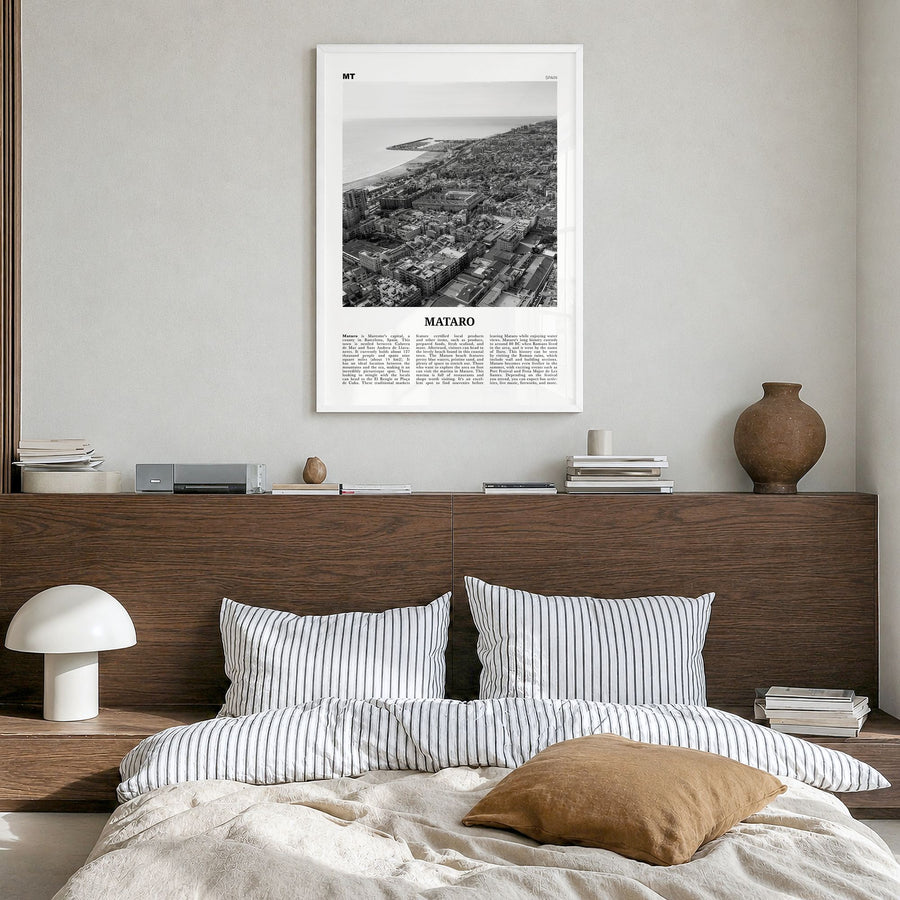 Mataró Newspaper Poster in a white wood frame, hanging in a bedroom
