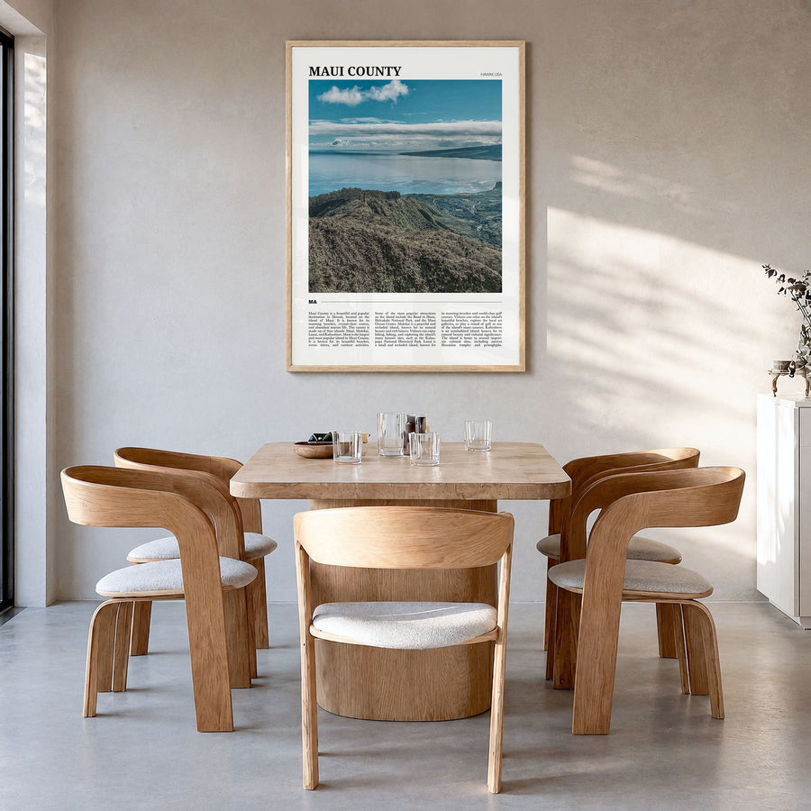 Maui County Travel Poster in a natural wood frame, hanging in a dining room