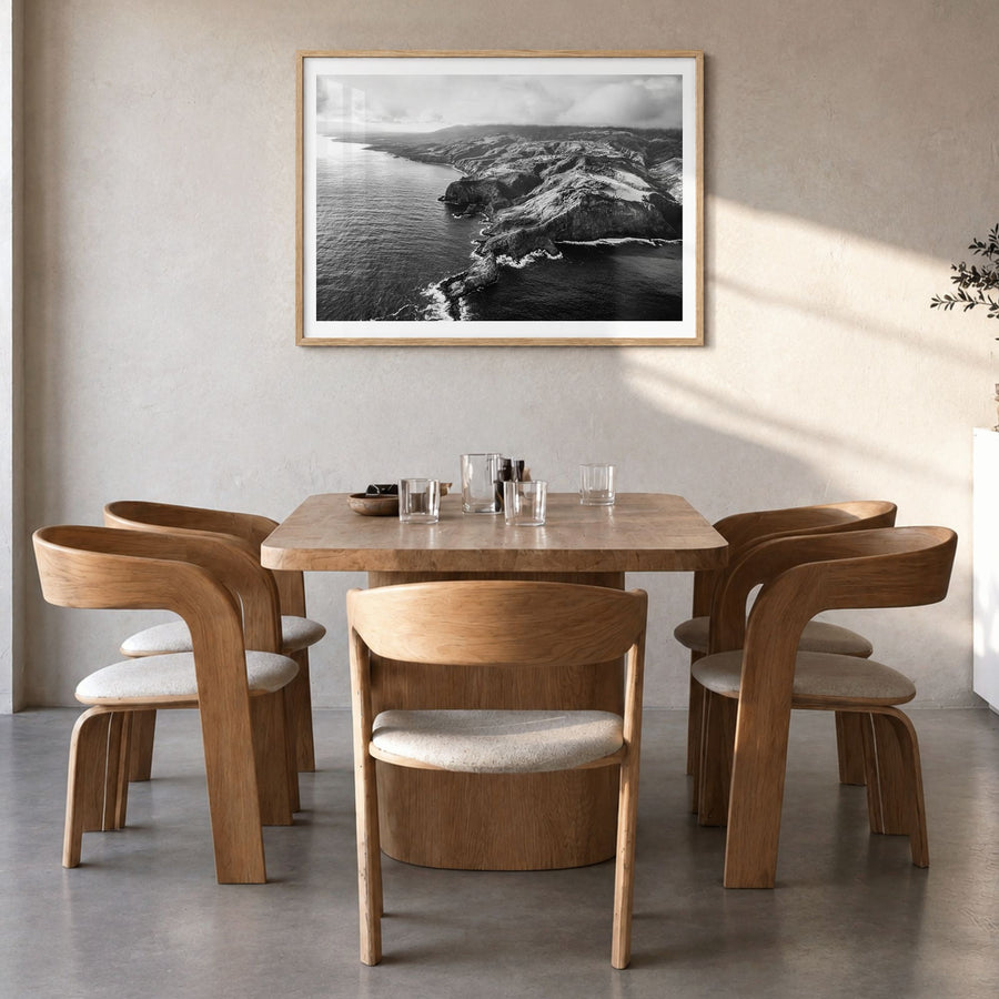 Maui Photo Poster in a natural wood frame, hanging in a dining room, white border
