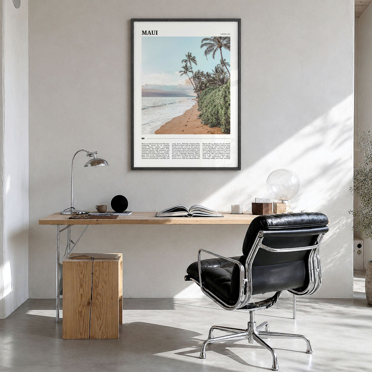 Maui Travel Poster in a black wood frame, hanging in a bright home office